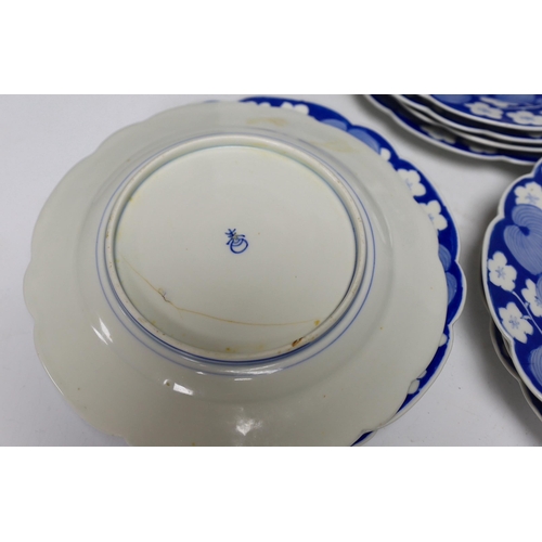 427 - Twelve Japanese blue and white fish plates, 21cm diameter