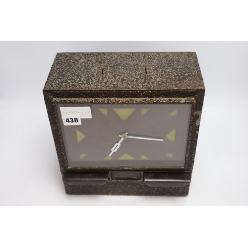 438 - A coin operated metal clockwork timepiece cigarette dispenser, 29cm