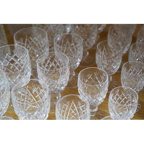 446 - A suite of Waterford drinking glasses in various sizes, including wine glasses, liqueur glasses, cha... 