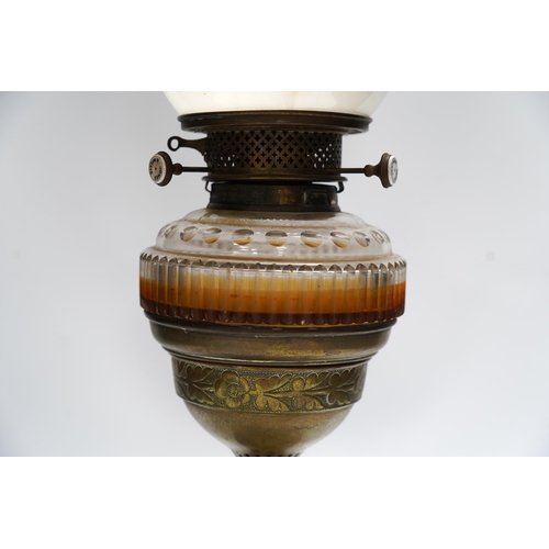 447 - A Victorian glass and brass oil lamp by Jones & Willis, 53cm high