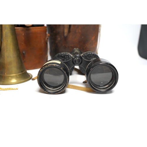 448 - Two cased pairs of binoculars and a brass bugle.