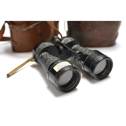 448 - Two cased pairs of binoculars and a brass bugle.