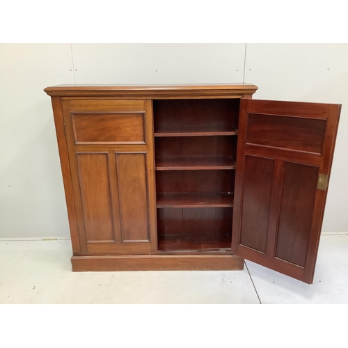 45 - An Edwardian mahogany two door side cabinet, (loose plinth), width 124cm, depth 29cm, height 126cm... 