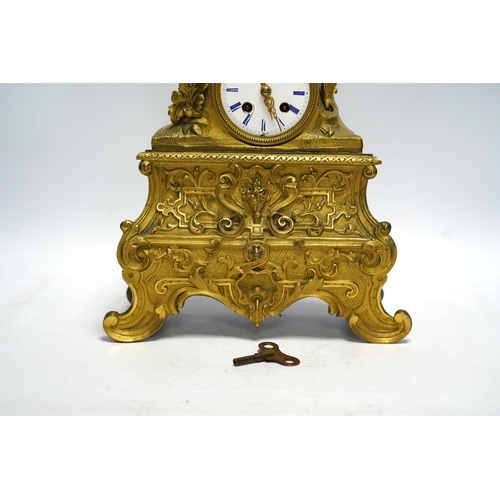 456 - A mid 19th century French ormolu figural mounted clock with silk suspension, with key, 36cm