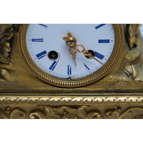 456 - A mid 19th century French ormolu figural mounted clock with silk suspension, with key, 36cm