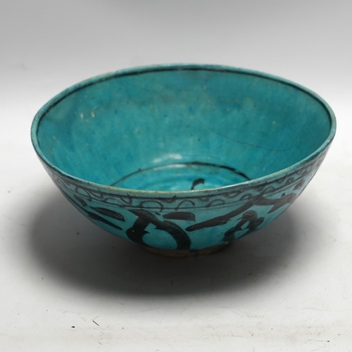 463 - A Kashan turquoise glazed fritware bowl, Persia, 13th/14th century, 25cm diameter