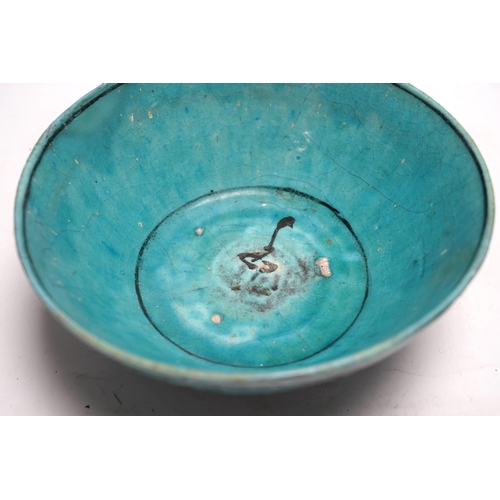 463 - A Kashan turquoise glazed fritware bowl, Persia, 13th/14th century, 25cm diameter