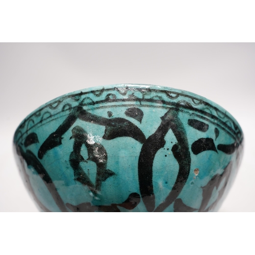 463 - A Kashan turquoise glazed fritware bowl, Persia, 13th/14th century, 25cm diameter