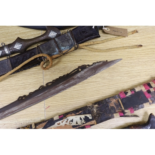 490 - A group of assorted bladed weapons including a kukri, a jambiya, etc, longest 84cm