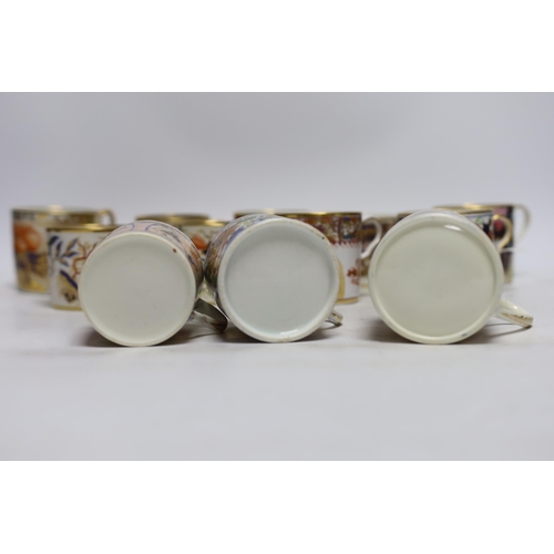 504 - Twelve 1800-1820 English porcelain coffee cans, including Imari pattern examples