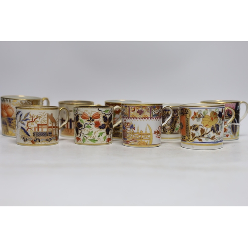 504 - Twelve 1800-1820 English porcelain coffee cans, including Imari pattern examples