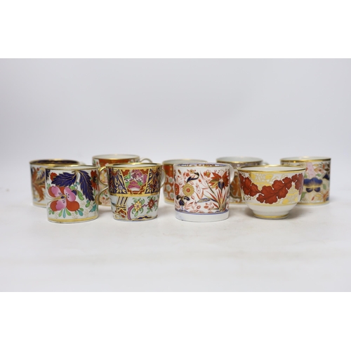 506 - Twelve 1800-1820 English porcelain coffee cans and tea cups, including Imari pattern examples