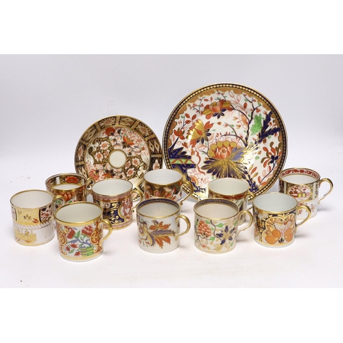 509 - Ten 1800-1820 English porcelain coffee cans, including Imari pattern examples, one with matching sau... 