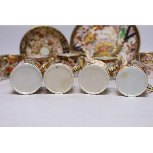 509 - Ten 1800-1820 English porcelain coffee cans, including Imari pattern examples, one with matching sau... 