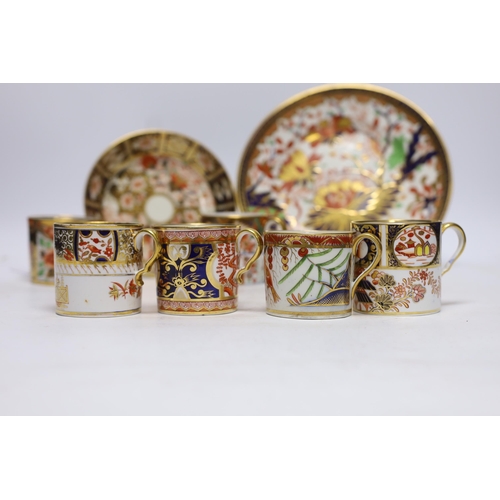 509 - Ten 1800-1820 English porcelain coffee cans, including Imari pattern examples, one with matching sau... 