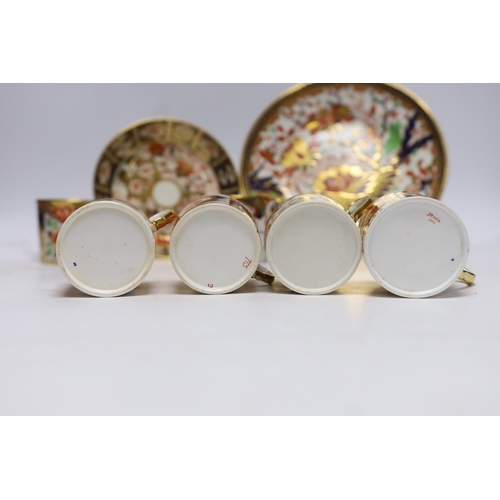 509 - Ten 1800-1820 English porcelain coffee cans, including Imari pattern examples, one with matching sau... 