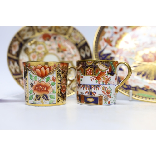 509 - Ten 1800-1820 English porcelain coffee cans, including Imari pattern examples, one with matching sau... 