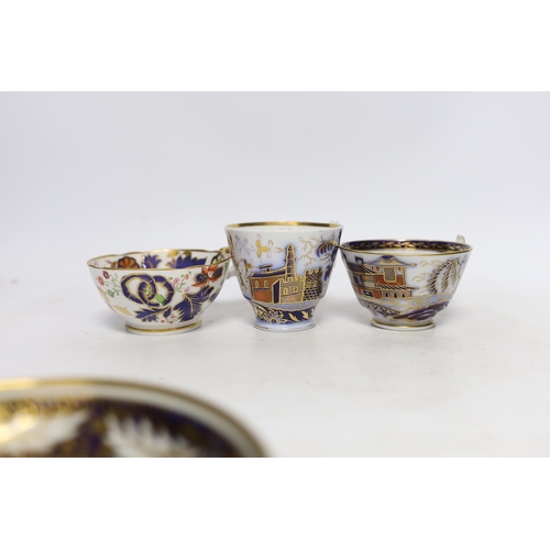 512 - Eleven 1800-1820 English porcelain coffee cans and tea cups, including Imari pattern examples, one w... 