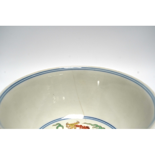 516 - A Chinese wucai dragon and phoenix bowl, early 20th century, diameter 15cm