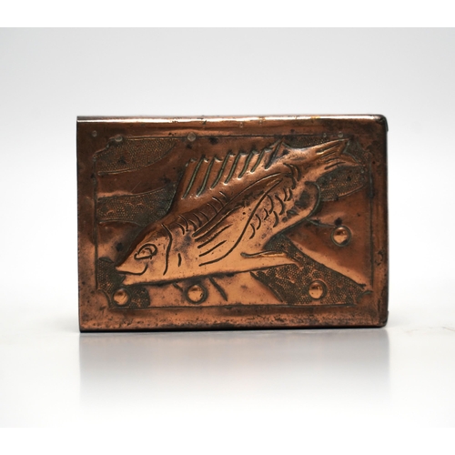 518 - A Newlyn copper matchbox cover, decorated with a fish, 7.5cm wide