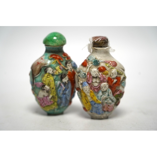 529 - Two 19th century Chinese moulded and enamelled porcelain eight immortals snuff bottles, largest 8c... 