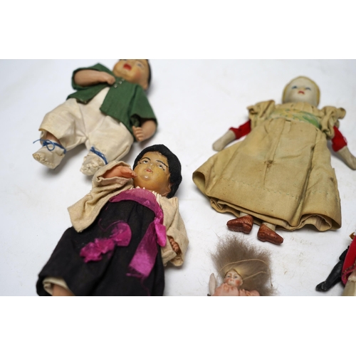 545 - Five various small world dolls, two celluloid and three bisque/china, largest 15cm high