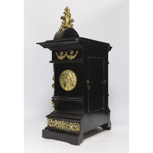 565 - An ebonised German bracket clock with brass decoration, with a Lenzkirch movement striking on a coil... 