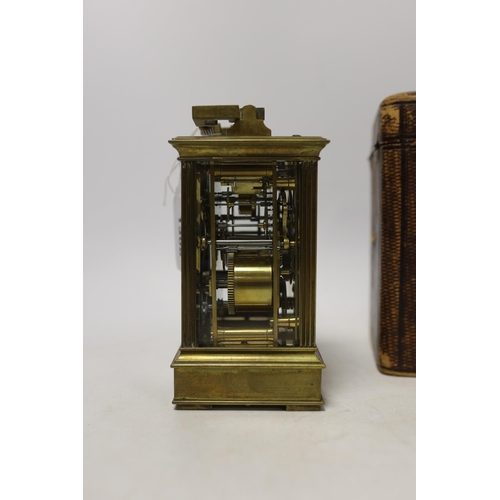 566 - A cased early 20th century brass repeating carriage clock with alarm, 15.5cm