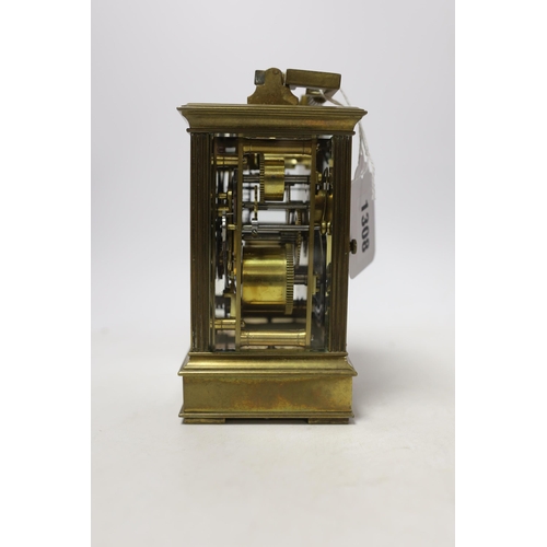 566 - A cased early 20th century brass repeating carriage clock with alarm, 15.5cm