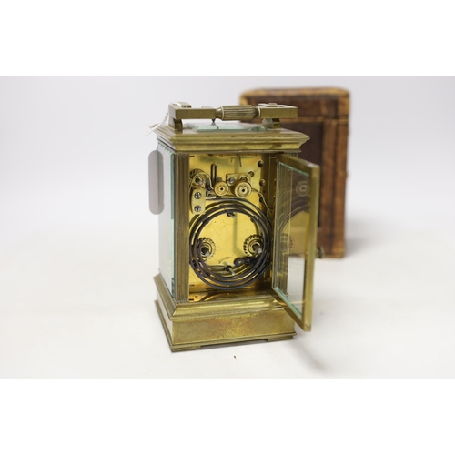 566 - A cased early 20th century brass repeating carriage clock with alarm, 15.5cm