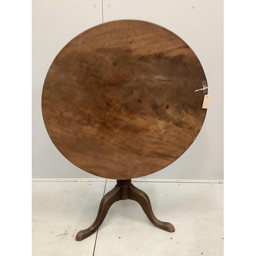 80 - An early 19th century circular mahogany tilt top tripod tea table, diameter 84cm, height 72cm