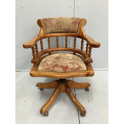 81 - A Victorian style pine swivel desk chair, width 62cm, depth 53cm, height 82cm