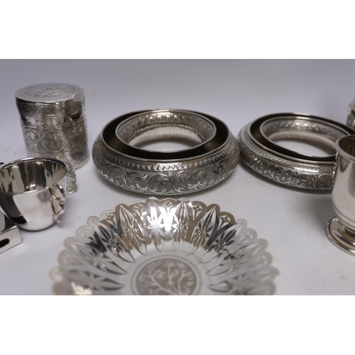 860 - A group of silver and a white metal items including two Middle Eastern ring vases, two foliate dishe... 