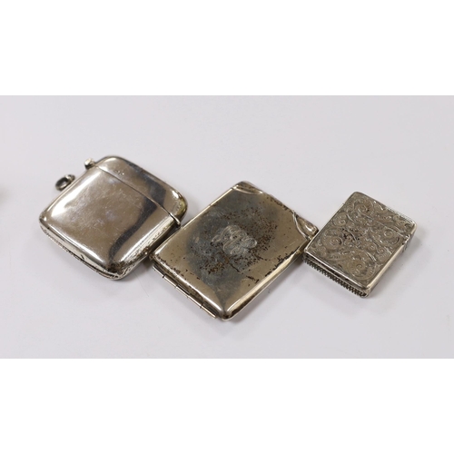 870 - Two silver vesta cases, largest 49mm and two silver match sleeves.