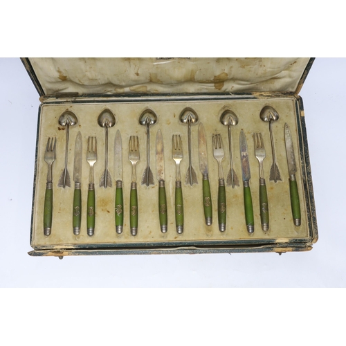 884 - A cased French thirty six piece dessert set, comprising twelve white metal spoons and twelve pairs o... 