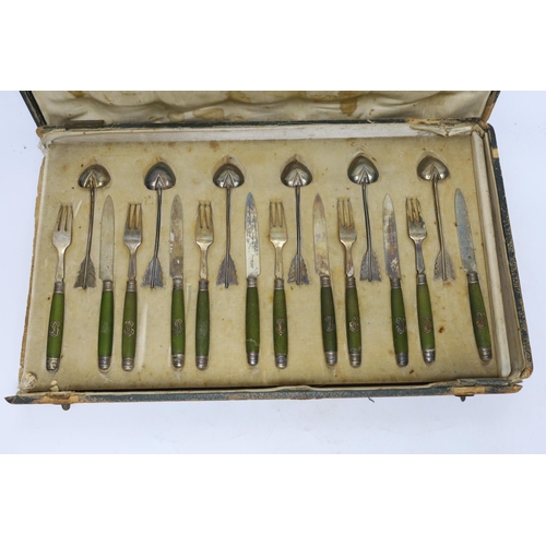 884 - A cased French thirty six piece dessert set, comprising twelve white metal spoons and twelve pairs o... 