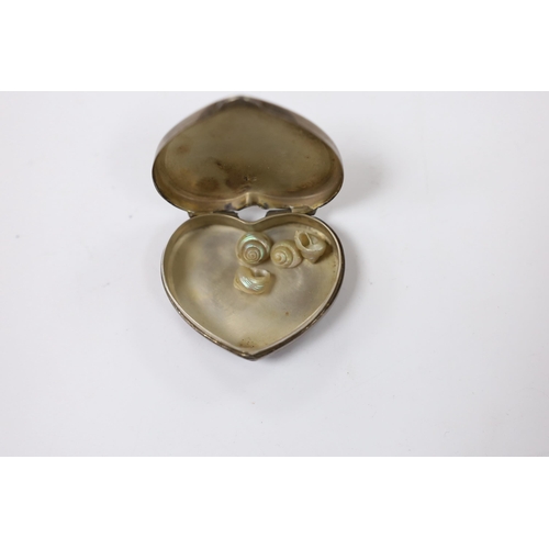 886 - A 20th century Cartier sterling and enamel heart shaped pill box, decorated with flower heads, width... 