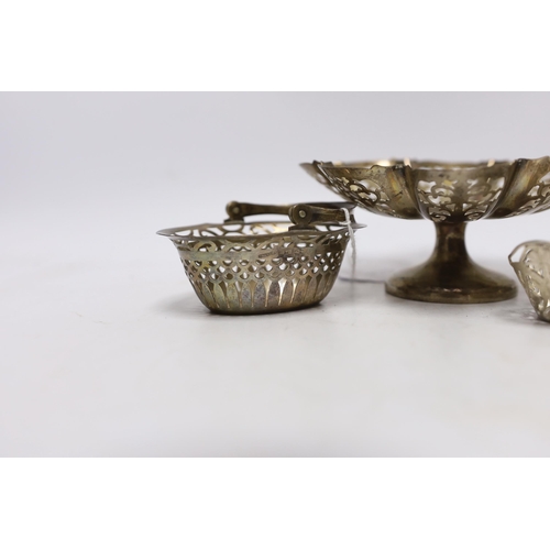 893 - A small silver basket, a pierced silver pedestal dish, a George V silver five bar toast rack and a p... 