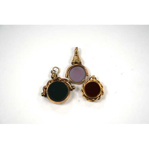 912 - Three late Victorian carnelian set fob seals including 18ct rolled gold, largest 3mm.