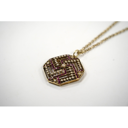 913 - An Edwardian 15ct, ruby and seed pearl set octagonal pendant, 35mm, gross weight 9.7 grams, on a gil... 