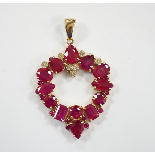 926 - A modern 14k, ruby(treated) and diamond cluster set open work pendant, overall 52mm, gross weight 10... 