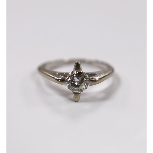 935 - A modern white metal and solitaire diamond set ring, size K, gross weight 3.5 grams.