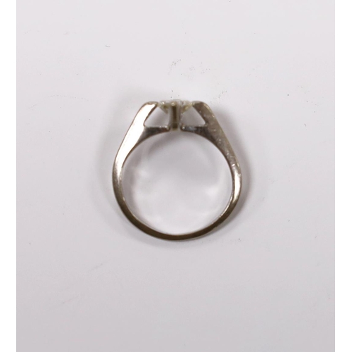 935 - A modern white metal and solitaire diamond set ring, size K, gross weight 3.5 grams.