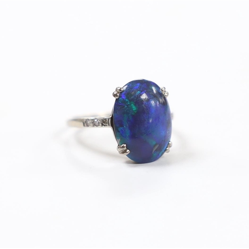 937 - An 18ct, plat and single stone cabochon black opal set ring, with six stone diamond chip set shoulde... 