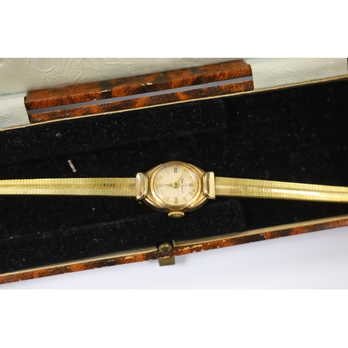 948 - A gentleman's Raymond Weil 18k gold plated quartz dress wrist watch, a similar Bulova steel and gold... 