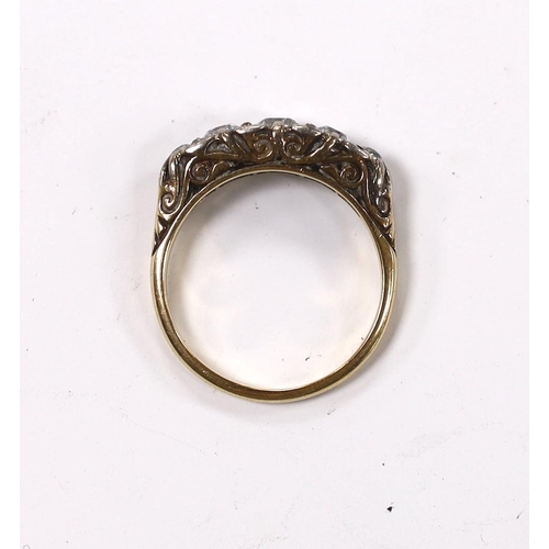 956 - An early 20th century 18ct, plat and graduated five stone diamond set half hoop ring, with diamond c... 