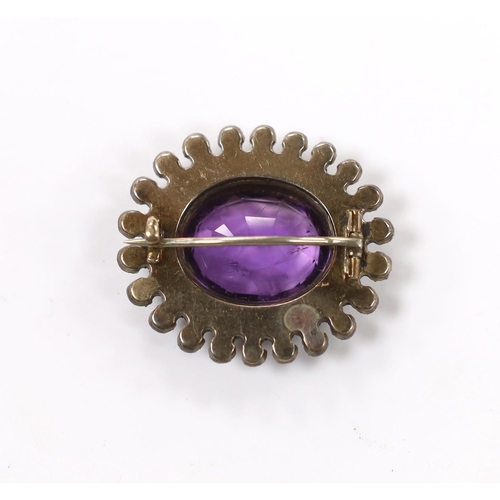 960 - An early 20th century yellow and white metal, amethyst and paste set oval cluster brooch, 33mm.... 