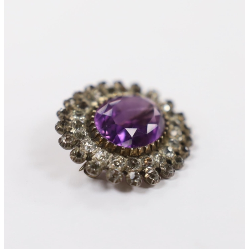 960 - An early 20th century yellow and white metal, amethyst and paste set oval cluster brooch, 33mm.... 