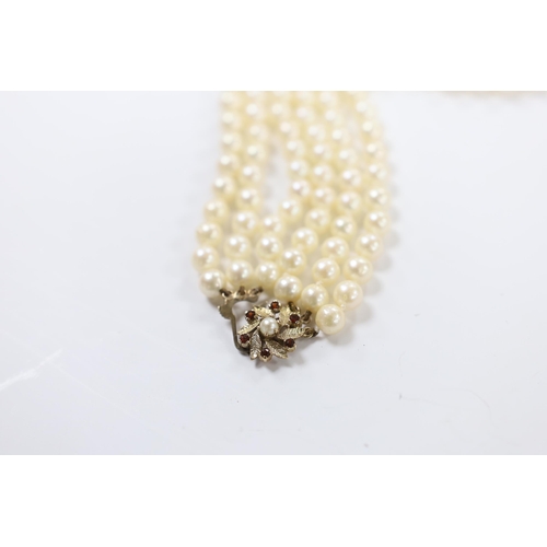 967 - A triple strand cultured pearl choker necklace, with cultured pearl and garnet cluster set 9ct gold ... 