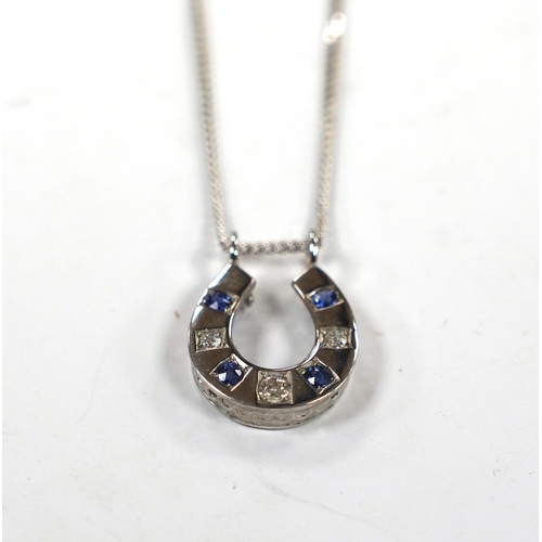 975 - A modern 18ct white gold, sapphire and diamond set horseshoe pendant on chain, overall 44cm, gross w... 